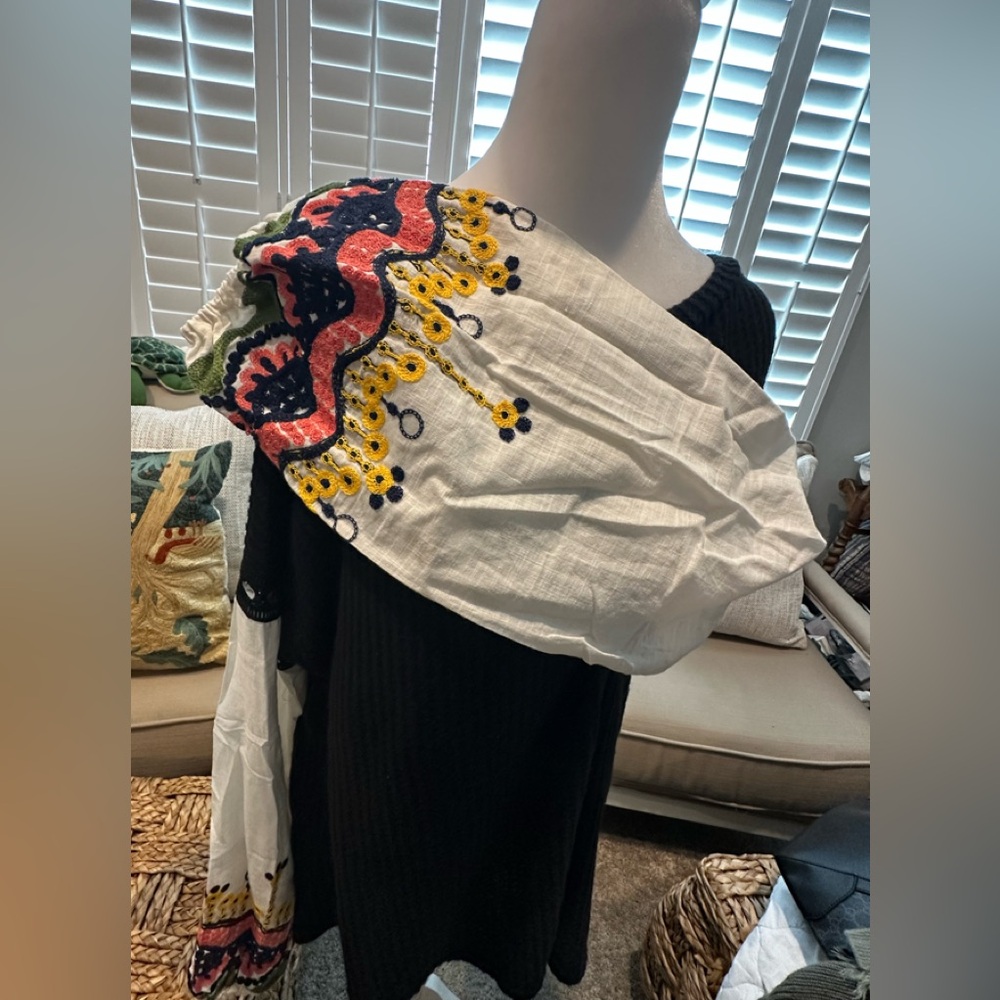 Black ribbed long sleeved top with embroidered white sleeves